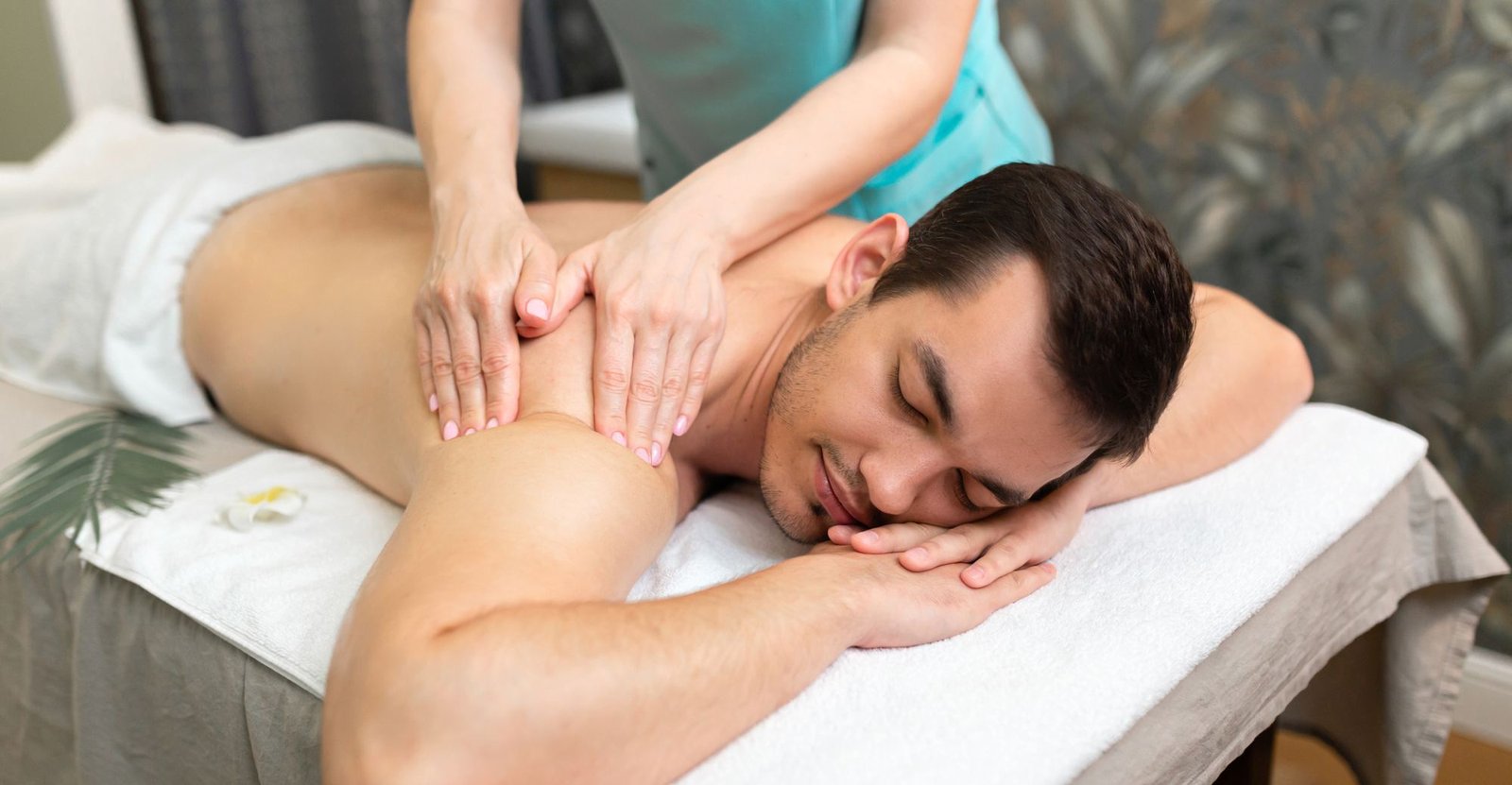 Therapist giving a deep tissue back massage at V3 Wellness Spa, Kondapur